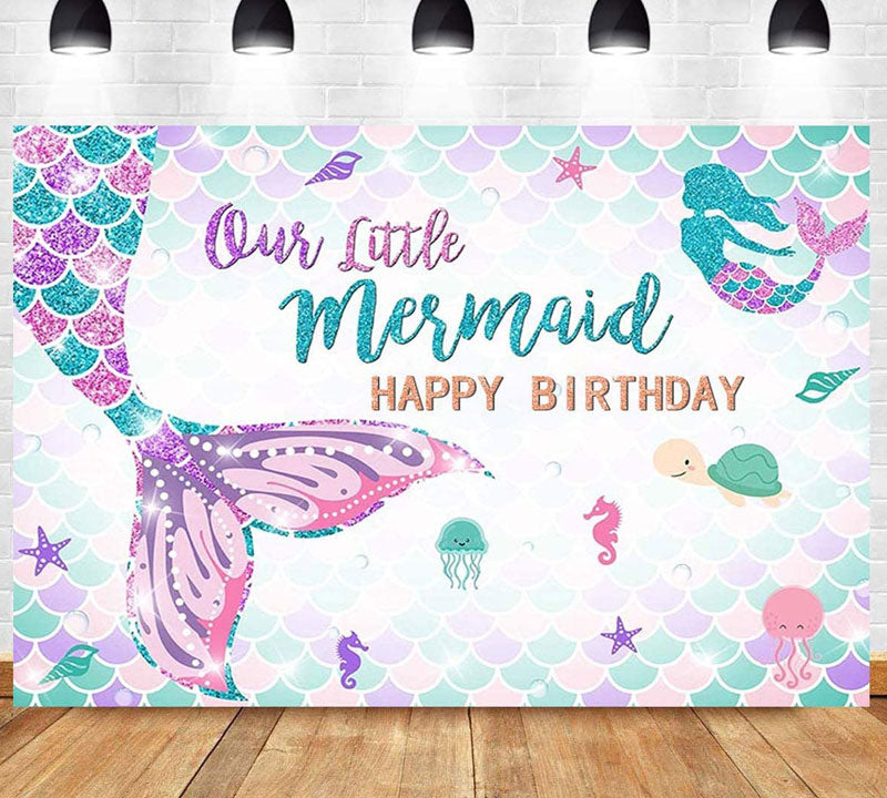 Our Little Mermaid Birthday Backdrop with a glittery mermaid tail featured.
