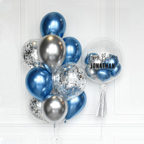Customized bubble balloon with a beautiful bouquet of chrome and confetti balloons.