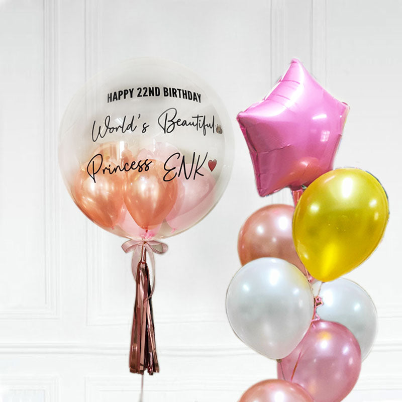 Customised  Bubble Balloon and a latex balloon bouquet topped with a star balloon.