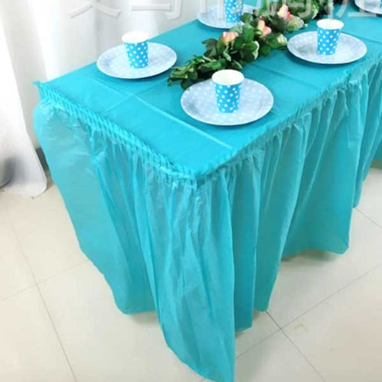 Set up your sea blue theme cake table skirting for your Frozen party