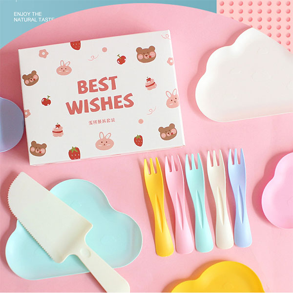 Serving cake with lovely and cute plates and utensils.