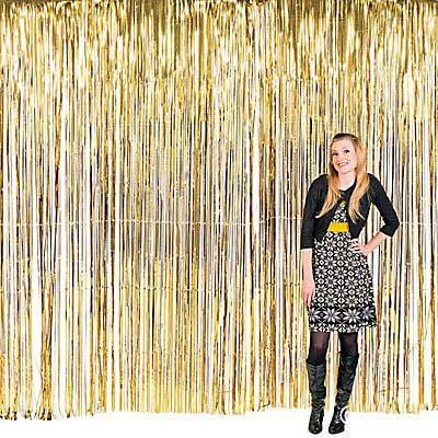 Set up your party bash with a nice welcoming photo booth with a gold tinsel foil backdrop like this.