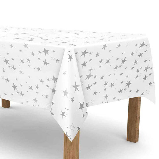 Silver stars glittering all over the white table cover. Makes a marvellous set up for a lovely cake cutting table.