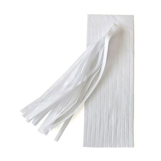 White paper tassels to dress up the party backdrop.