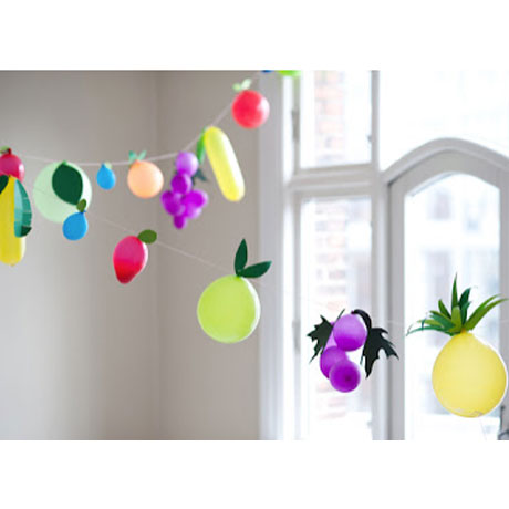 Using balloons to create fun fruit shapes to decorate for the birthday party.
