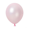 A light pink colored helium round latex balloon with a small ribbon attached to its string.