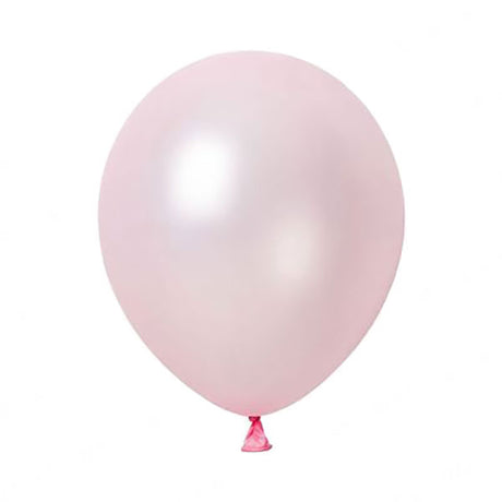 A light pink colored helium round latex balloon with a small ribbon attached to its string.