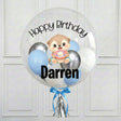 Clear bubble balloon with cartoon dog, 'Happy Birthday Darren' text, and blue and silver balloons on a white background.