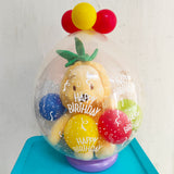 Adorable Pooh Bear Soft Toy in a cute pineapple suit being wrapped as a present.