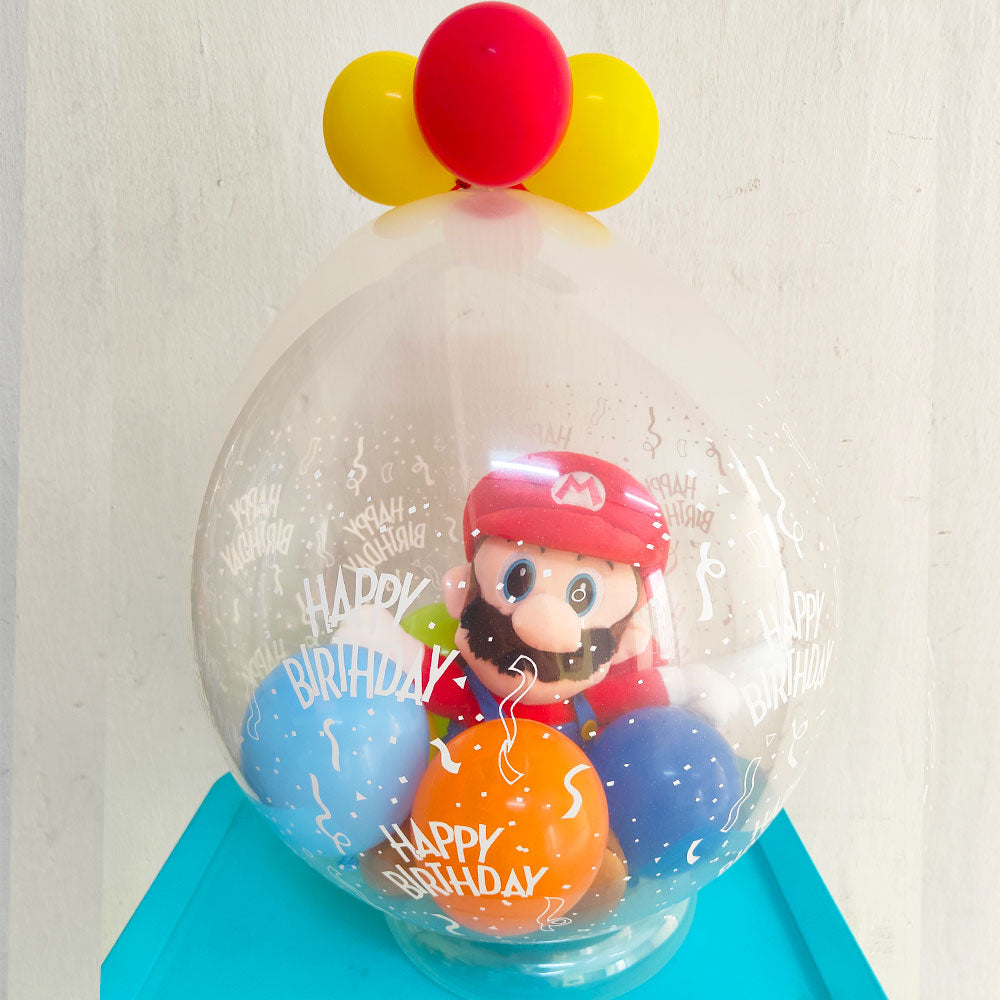 Super Mario Soft Toy wrapped in a balloon for the birthday gift]