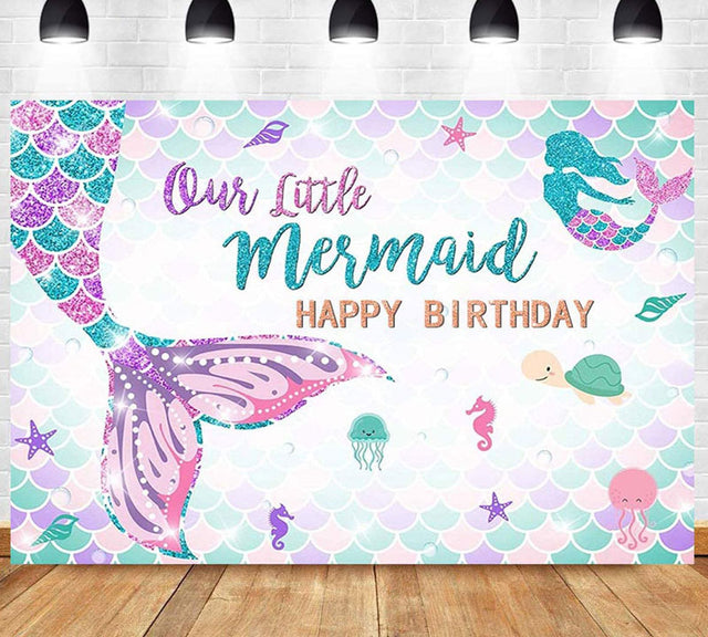 Our Little Mermaid Birthday Backdrop with a glittery mermaid tail featured.