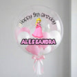 Transparent bubble balloon with pink and white balloons, Princess character, and text 'Happy 9th Birthday Alessandra' on a light gray background.