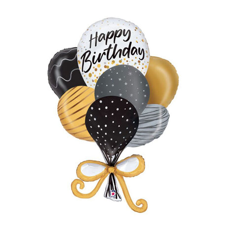 A cluster of metallic foil balloons on a white background. The set includes a white balloon with gold confetti and the words 'Happy Birthday' in black script, a black balloon with white polka dots, a gold balloon with black stripes, a gray balloon with white dots, a gray balloon with a wavy pattern, a gold balloon, and a black balloon with a chocolate-drink pattern.