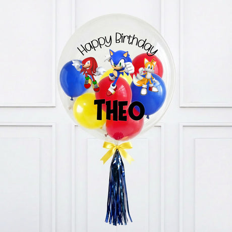 Personalized birthday balloon with cartoon characters and 'Happy Birthday Theo' text on a white background.