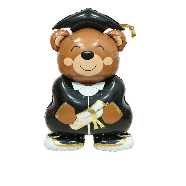 Graduation-themed balloon bear with a black graduation cap, gown, and scroll on a white background