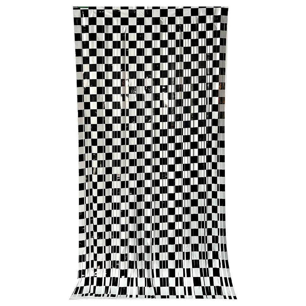 A black and white checkered curtain panel hanging against a plain white background.
