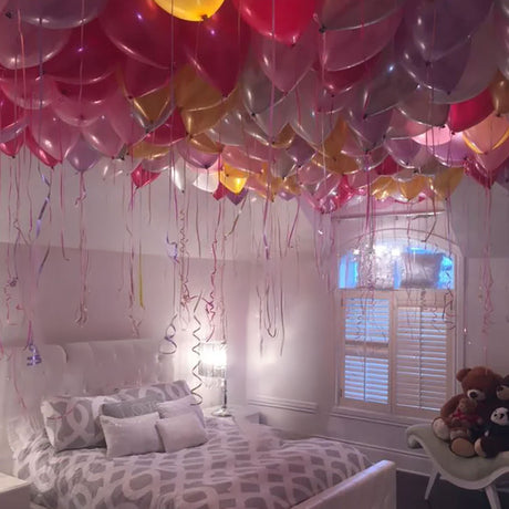 helium balloons floating on the ceiling