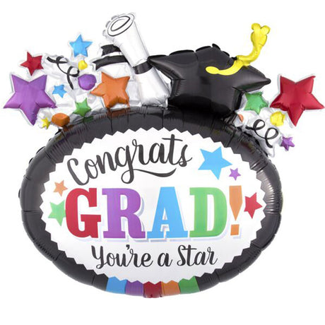 A celebratory graduation foil balloon set on a plain white background. The main balloon is black with a white center panel that reads “Congrats GRAD! You’re a Star” in colorful lettering, topped with a black graduation cap, rolled diploma, yellow diploma pen, and scattered multicolor stars.