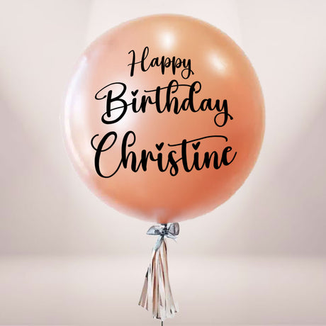 Rose gold balloon customised with a special message for the birthday star!
