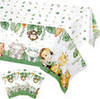Jungle-themed tablecloth with animal illustrations and green leaves on a white background