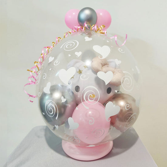 Load image into Gallery viewer, Hello Kitty Plush Toy wrapped inside a balloon for a special gift.

