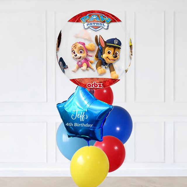 Paw Patrol-themed balloon set with personalized message on the star balloon