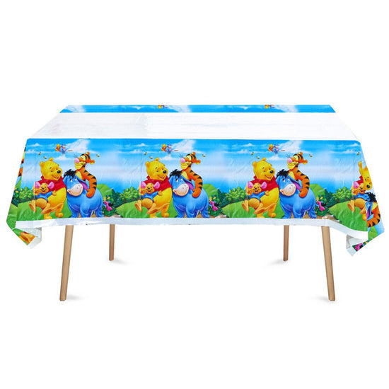 Winnie the Pooh and Tigger and Eeyore featured in this Pooh Birthday Party Table Cover.