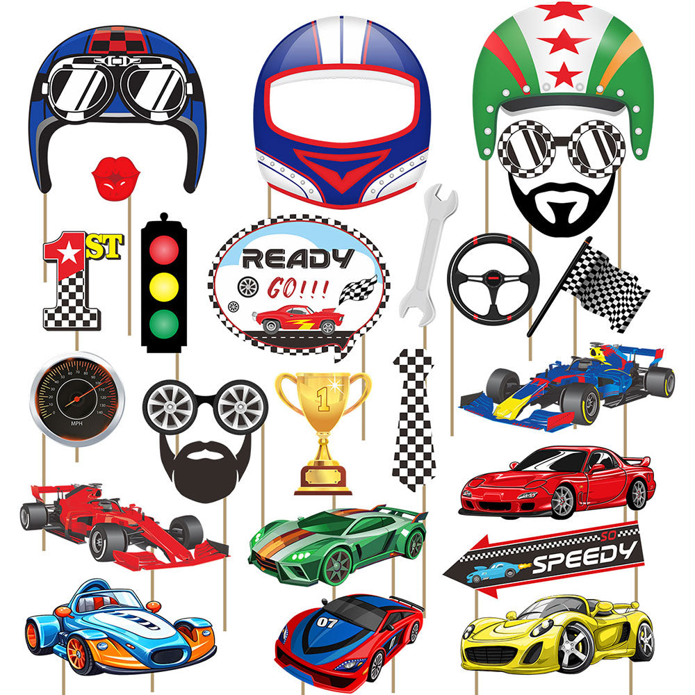 A set of colorful race car and racing-themed party cutout signs on sticks, including a helmet, racing goggles, checkered face mask, speed number, traffic light, trophy, steering wheel, flags, cars, and a speed sign, all arranged on a white background.