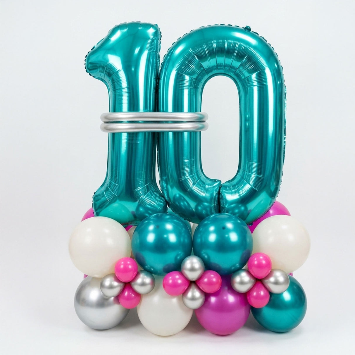 Turquoise number 10 balloon surrounded by smaller multicolored balloons on a white background