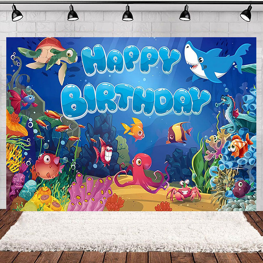 Underwater-themed birthday banner with colorful sea creatures and 'Happy Birthday' text.