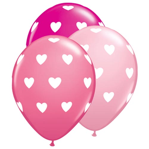 Pink toned latex balloons with hearts printed on them.