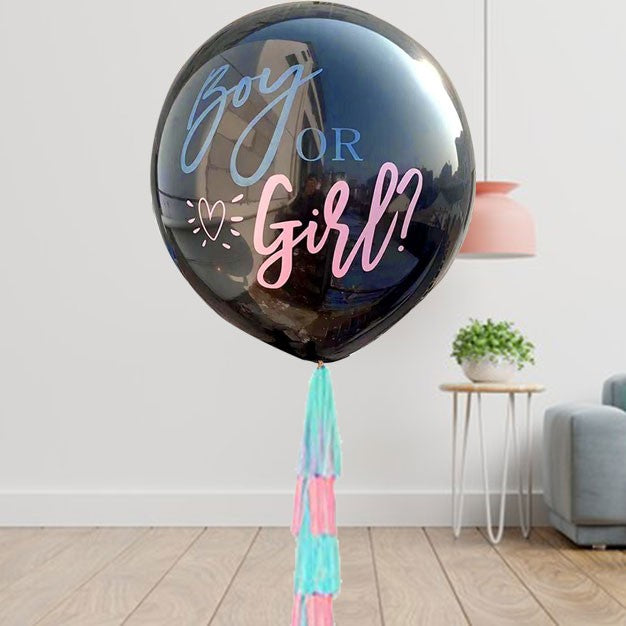 Gender Reveal Balloon in black. Upon bursting there will be blue or pink confetti flying all over, revealing if the baby is a boy or a girl.