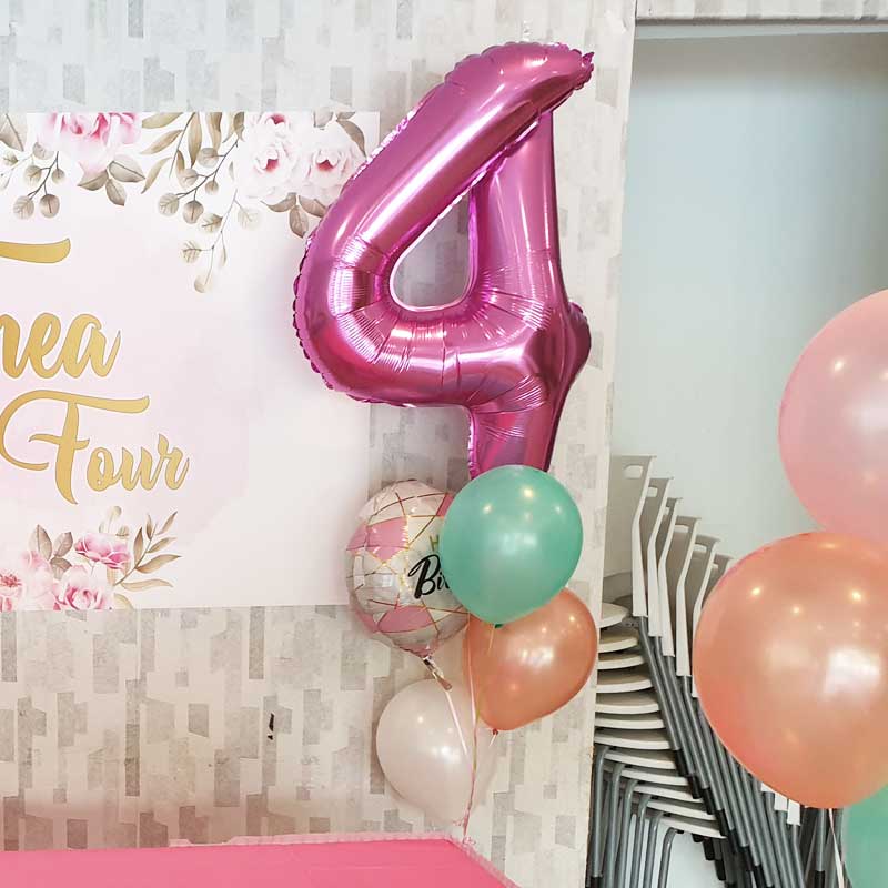 4th Birthday Party setup greatly enhanced by the presence of a jumbo sized pink number 4 balloon