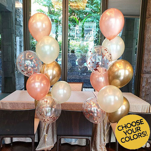 Lovely balloon bouquet in chrome and confetti and shiny gold and rose gold.