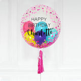 Customised bubble balloon with a personalised message on a clear bubble balloon with pink confetti all over.