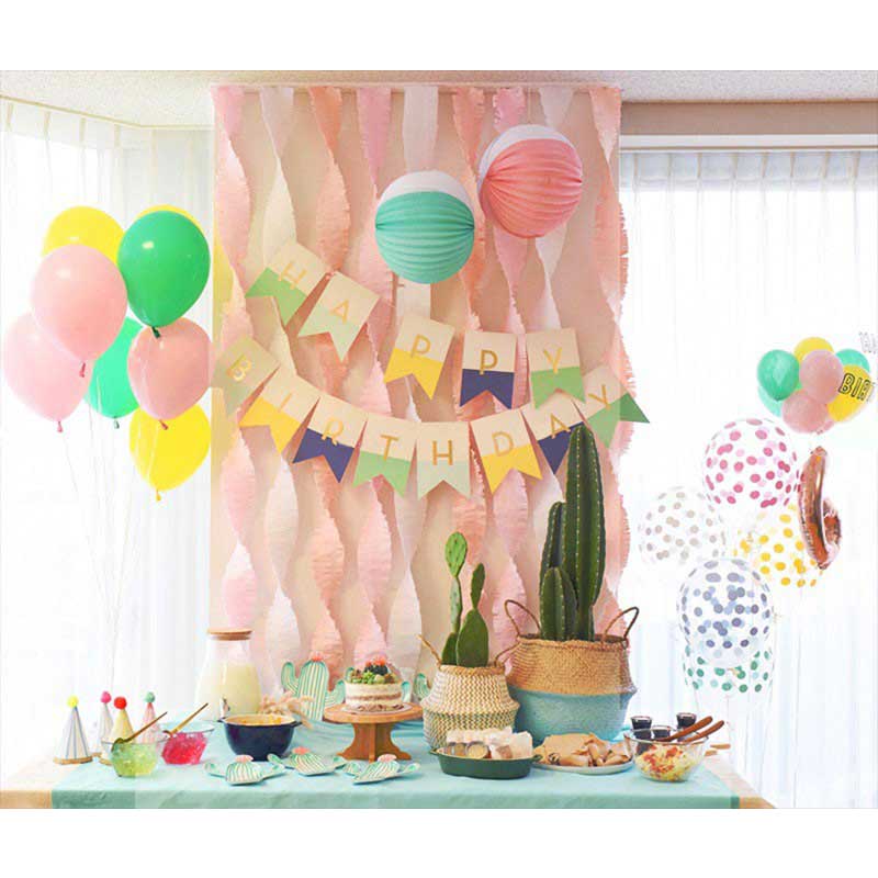 Dual coloured birthday banner match up with lively coloured streamers and balloons and lanterns for a marvellous dessert table setup.
