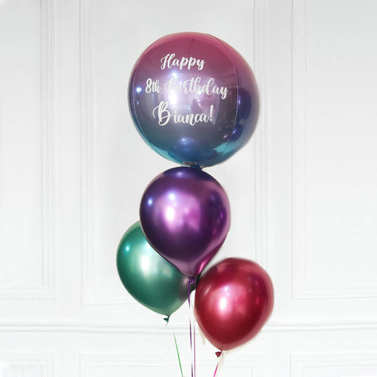 Colourful Chrome balloons matching with the colourful orbz balloon customized for the birthday star.