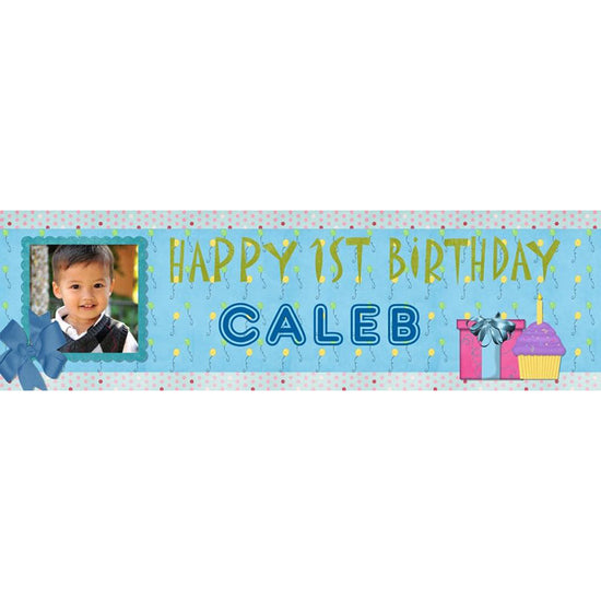 Blue Birthday Banner personalised to feature the birthday boy's photo and name. The banner is highlighted with gifts and cupcakes.