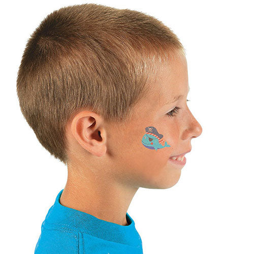 Boy having lots of fun at the party with the cute pirate animals tattoo on his face!