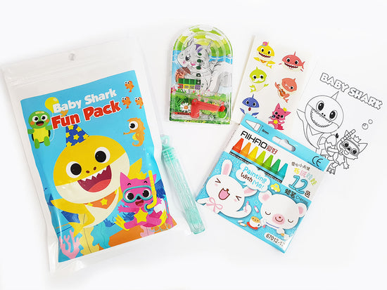 Baby shark goody bag filled with stickers, game, colouring sheet and crayons.
