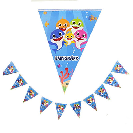 Hanging the Baby Shark Flag Banner at the backdrop of the cake table!