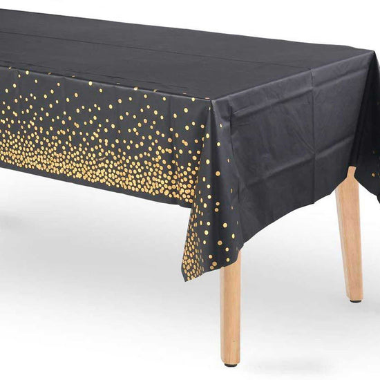 Gold Dots on Black Table Cover for the special 50th Birthday Party.
