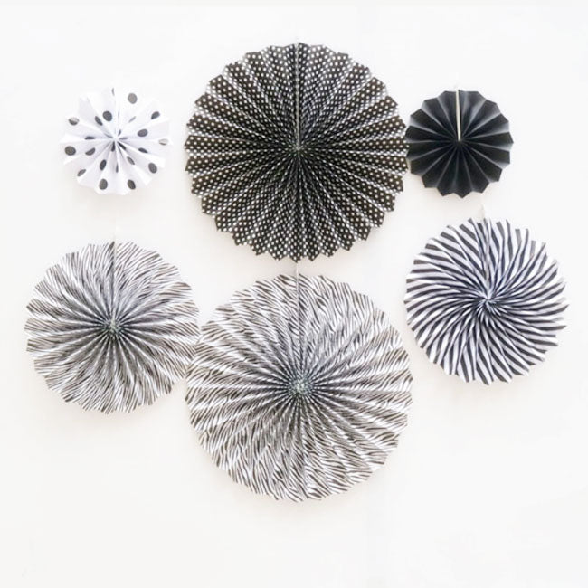 Paper fan decorations never fail to boost any backdrop decoration. They add to the colours and gives a special layered effect.  Black & White  paper fans mixed with polkadots and swirls and stripes provides high contrasts of colours.