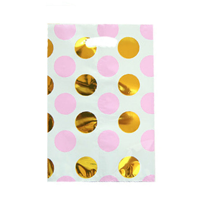 Large polka dots with pink and gold foil treat bags to pack these lovely little gifts.