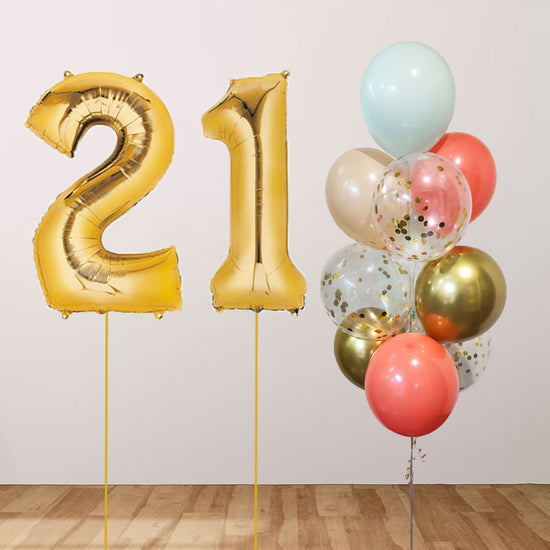 Gold number balloons to display for 21st birthday with a beautiful bouquet of confetti & chrome latex balloons.