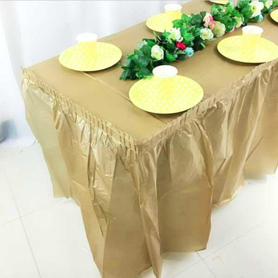 Set up table with gold skirting and tablecover for wedding or birthday or anniversary