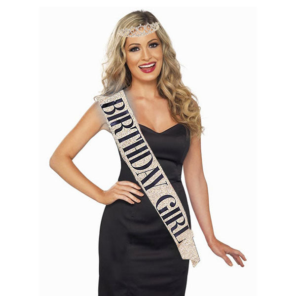 Birthday Girl dressing up glamorously in the glittery sash and tiara crown set.