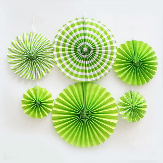 Green paper fans mixed with polkadots and swirls and stripes provides high contrasts of colours.