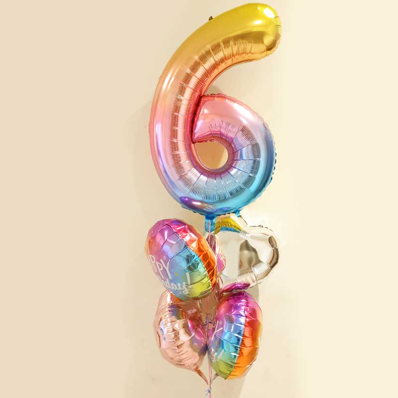 Ombre balloons with cheery colours for the 6-year-old birthday surprise.