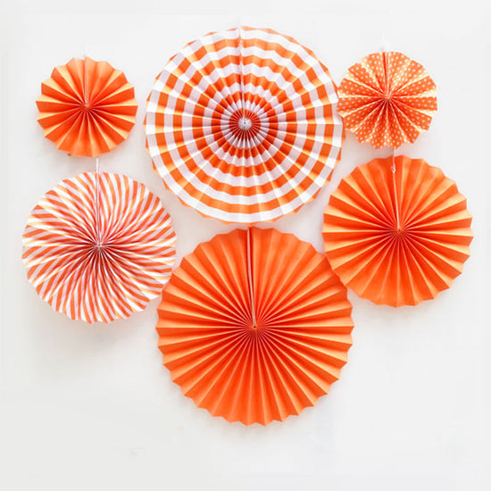 Load image into Gallery viewer, Paper fan decorations never fail to boost any backdrop decoration. They add to the colours and gives a special layered effect.  Orange paper fans mixed with polkadots and swirls and stripes provides high contrasts of colours.
